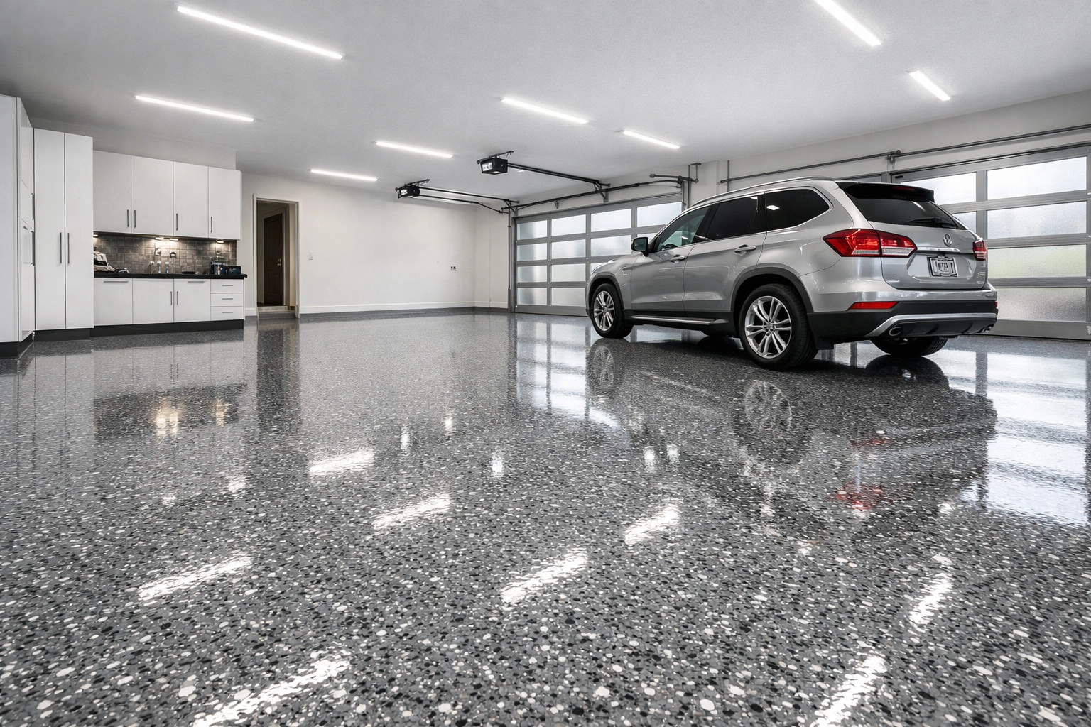 Luxury garage with grey-and-white flake garage floor coating in Madison MS, clean and bright