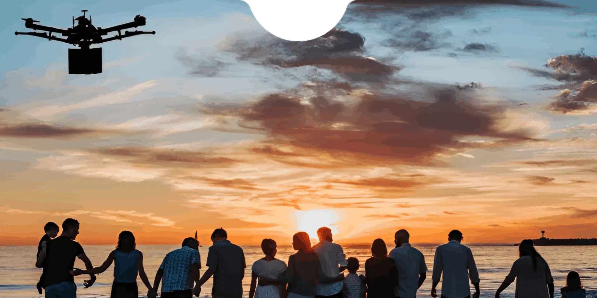 A professional drone preparing for a serene ash scattering ceremony over the coastline at sunset.