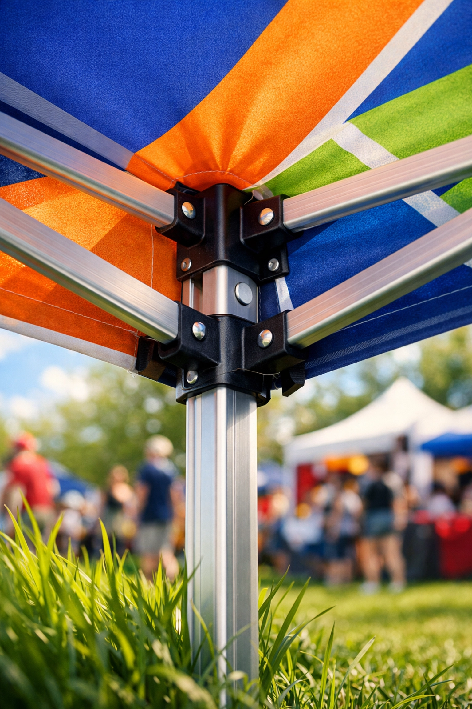 Custom canopy tent with printed fabric being set up at outdoor spring event