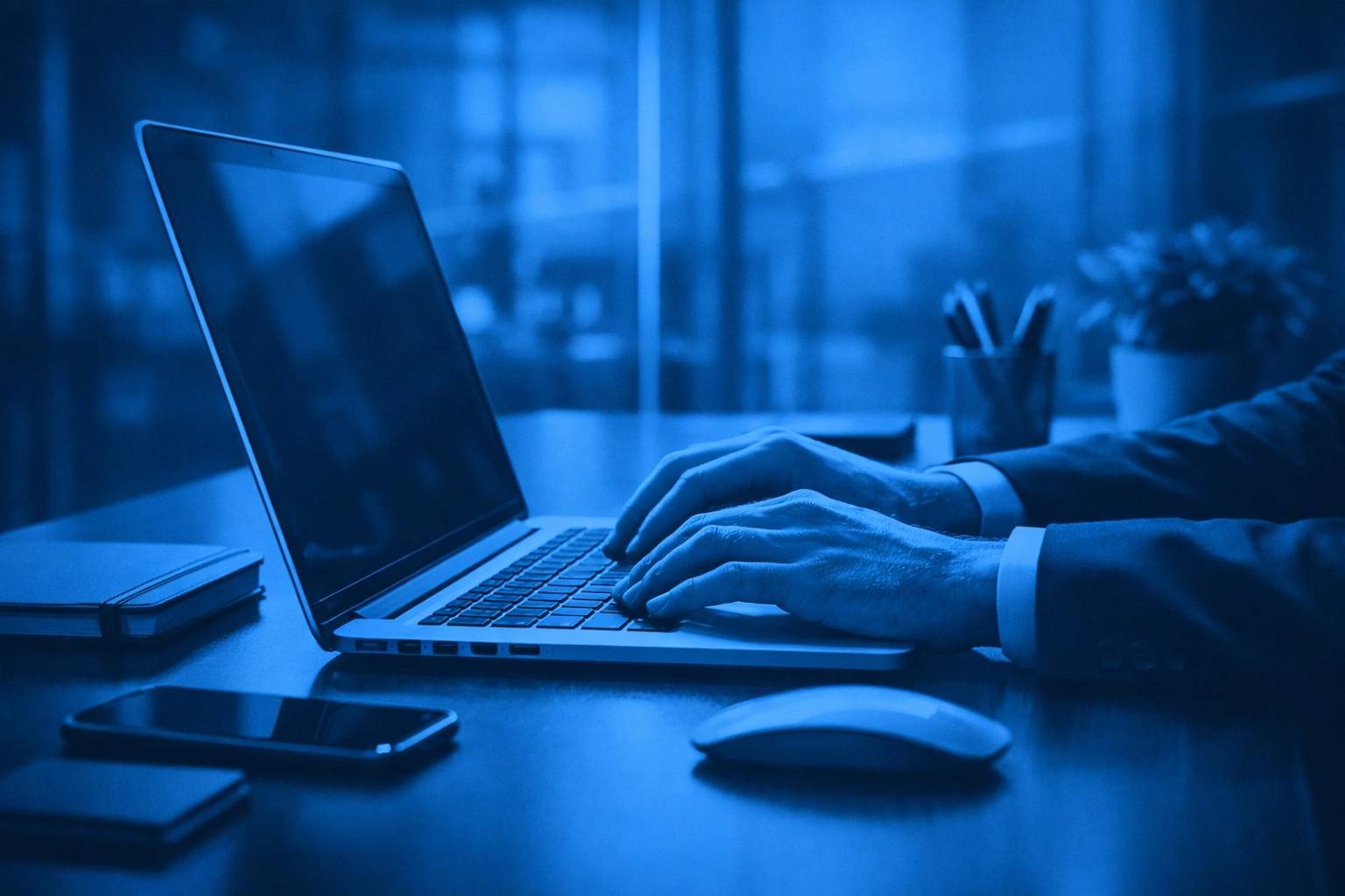 A professional at a modern workstation representing human oversight and secure AI management.