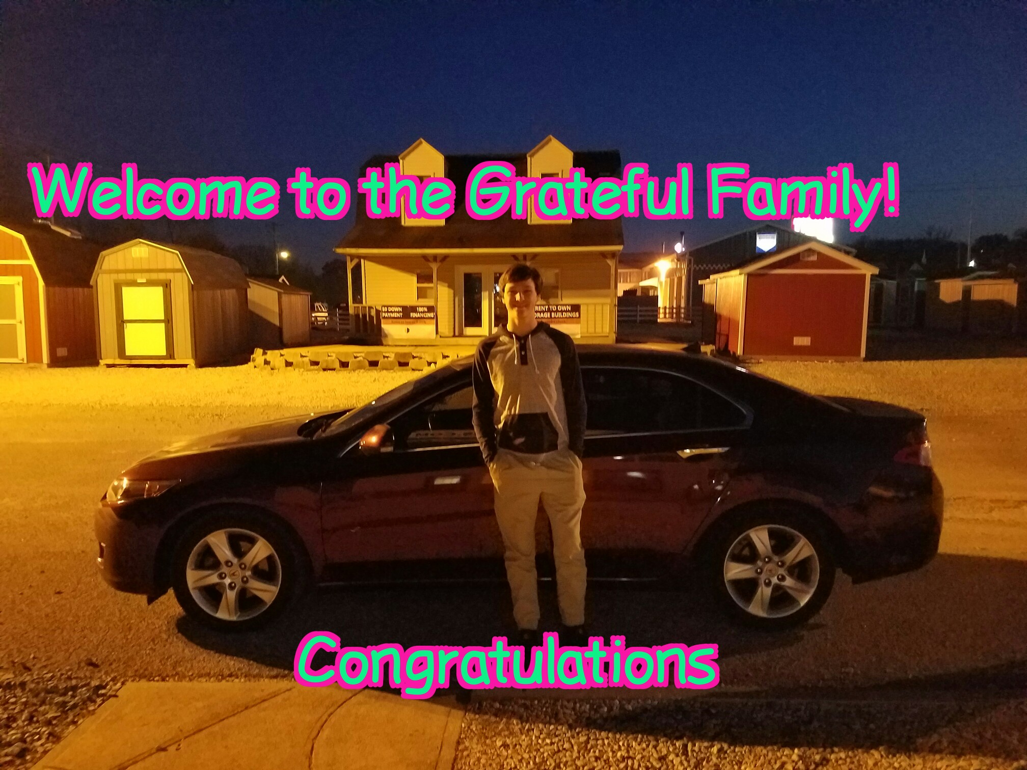 Customer with Newly Purchased Sedan at Grateful Motors