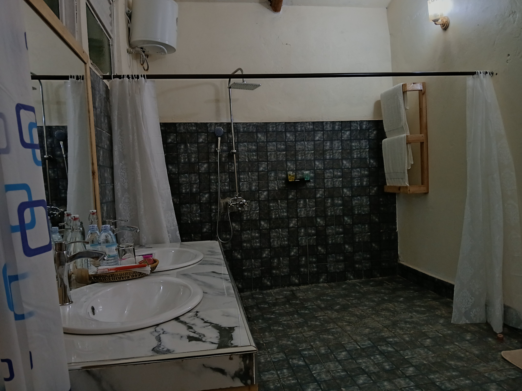 Spacious en-suite bathroom with sunlit bedroom access