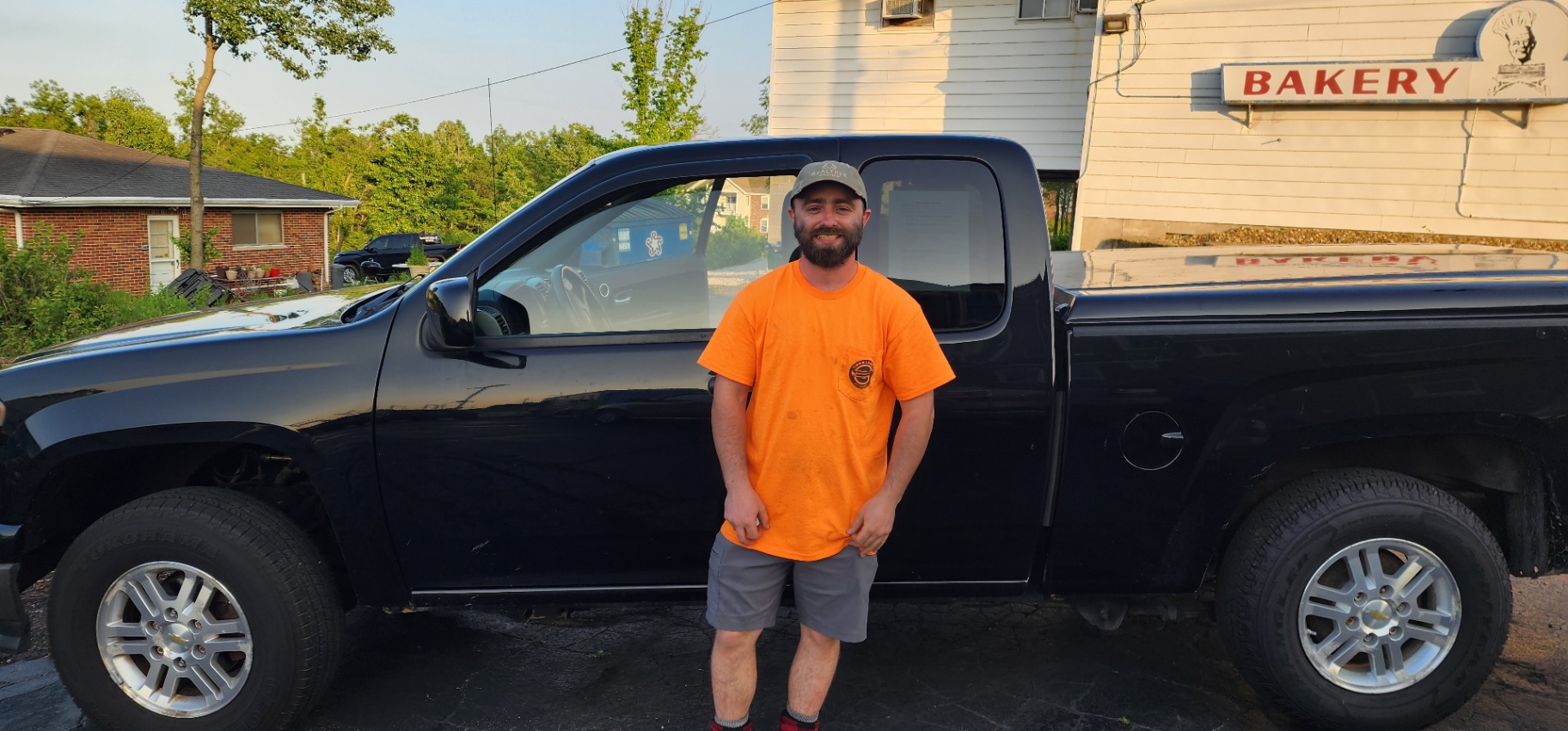 Customer with Black Pickup Truck at Grateful Motors