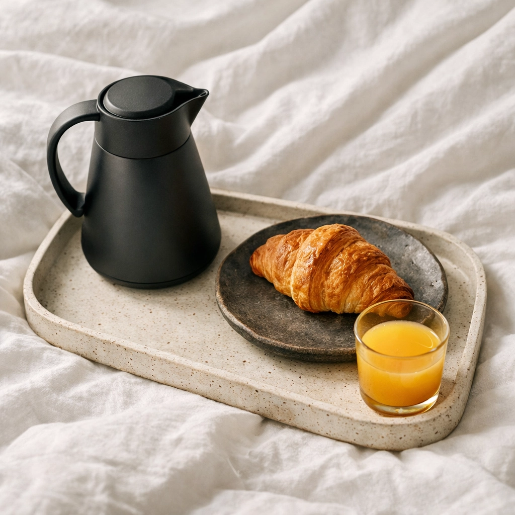 Luxury breakfast-in-bed service, an experience upsell offered via a hotel booking engine.