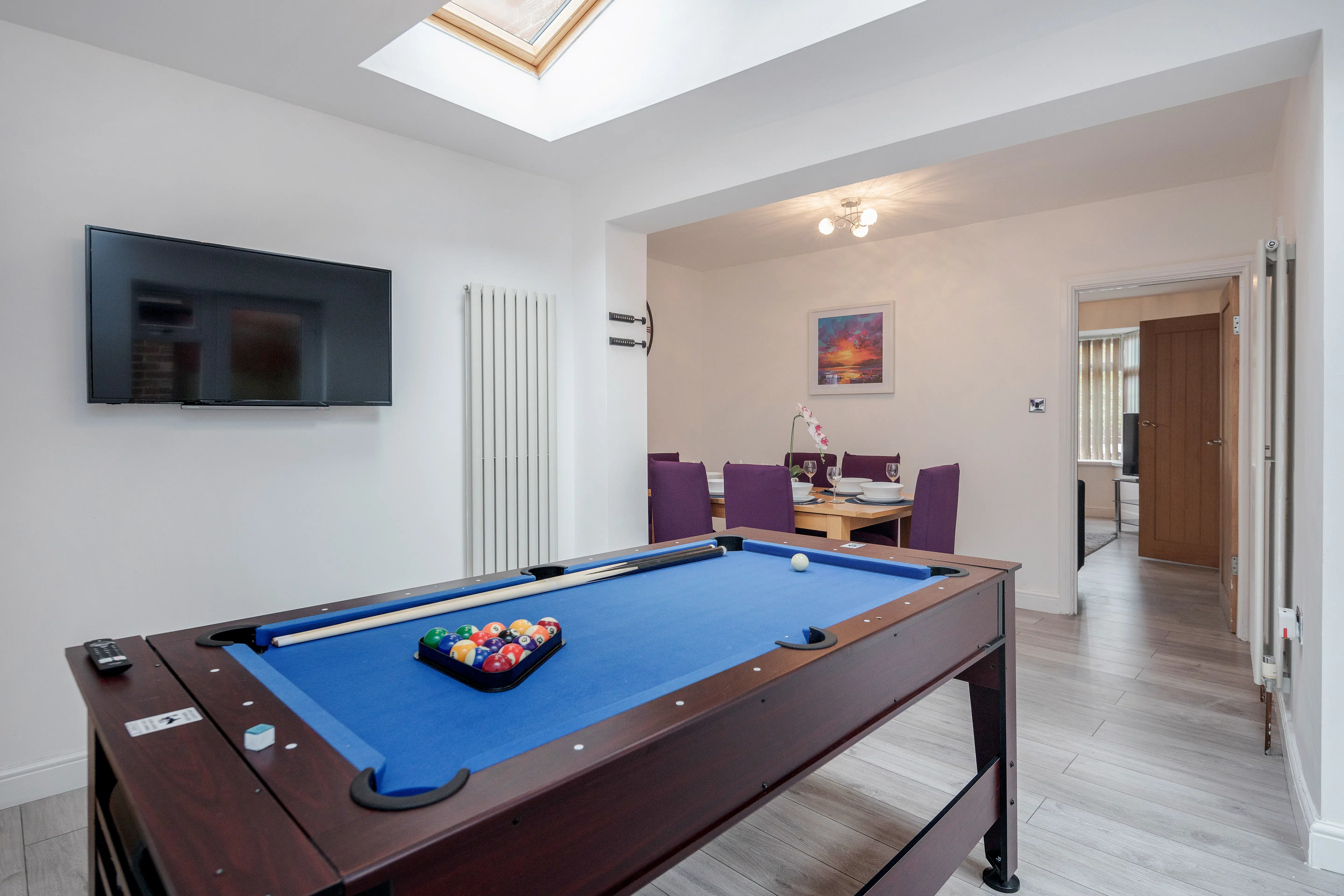 Cowridge House recreation area with pool table and dining space.