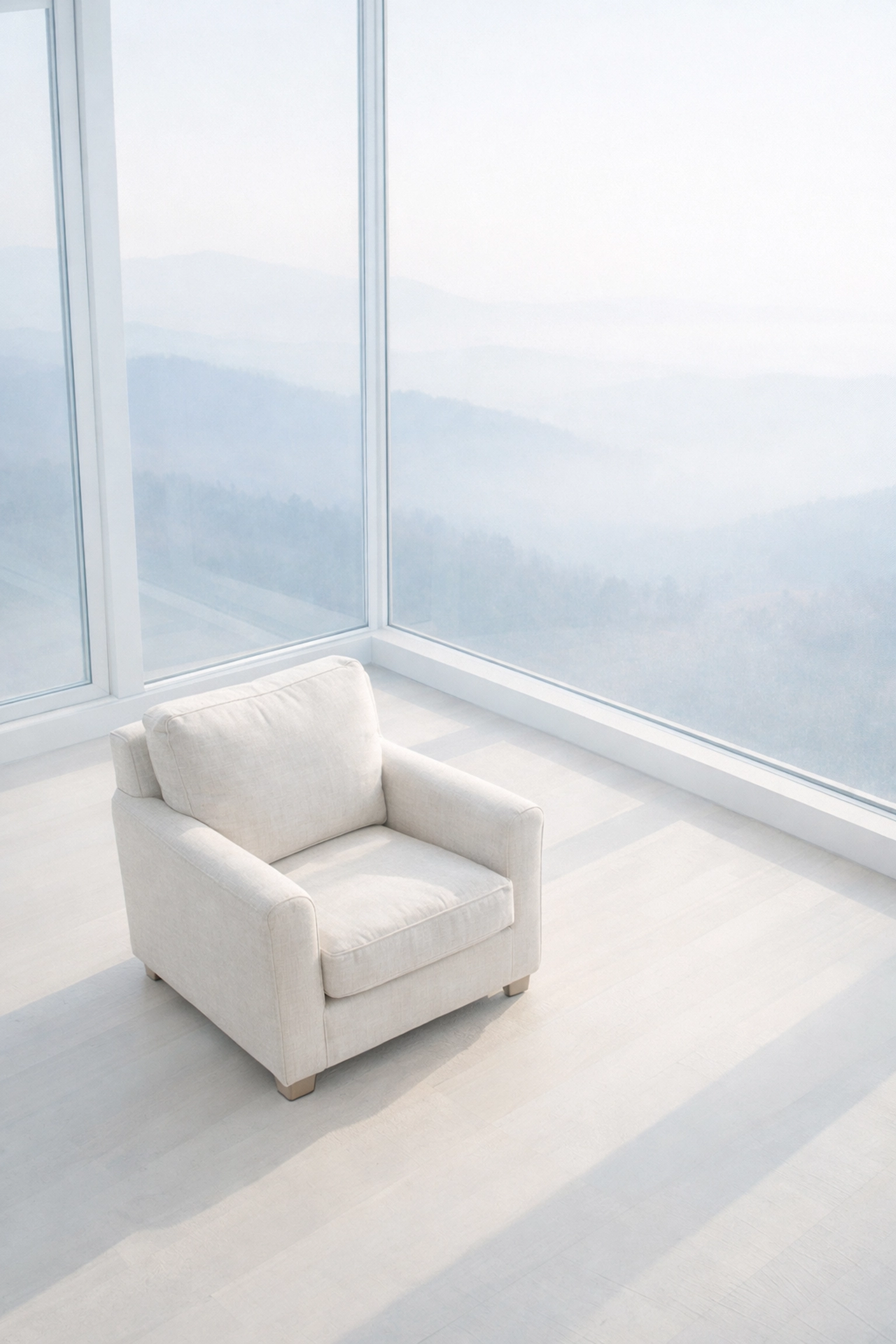 A quiet linen armchair in a peaceful room illustrating intentional solitude and executive rest.