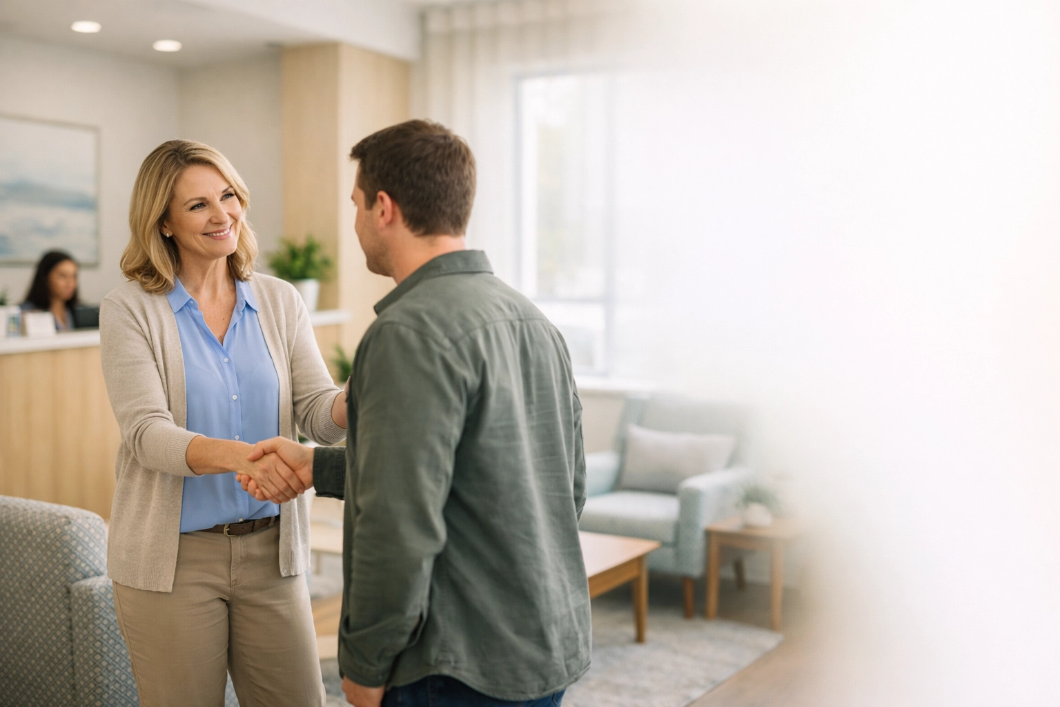 Welcoming treatment center lobby with professional staff to establish visual trust on a high-converting website.