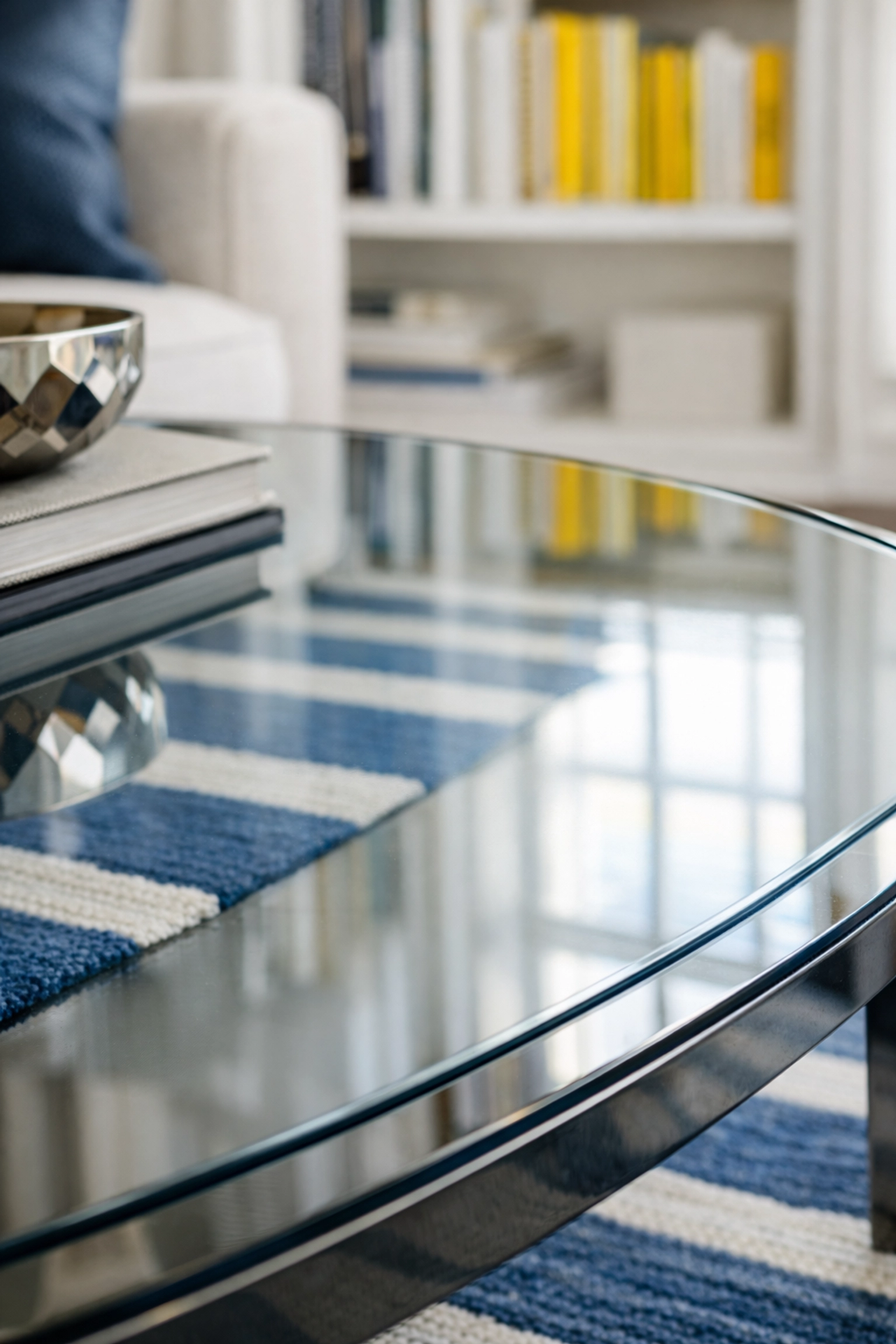 Close-up of a streak-free glass coffee table showing the precision of a professional house cleaning.