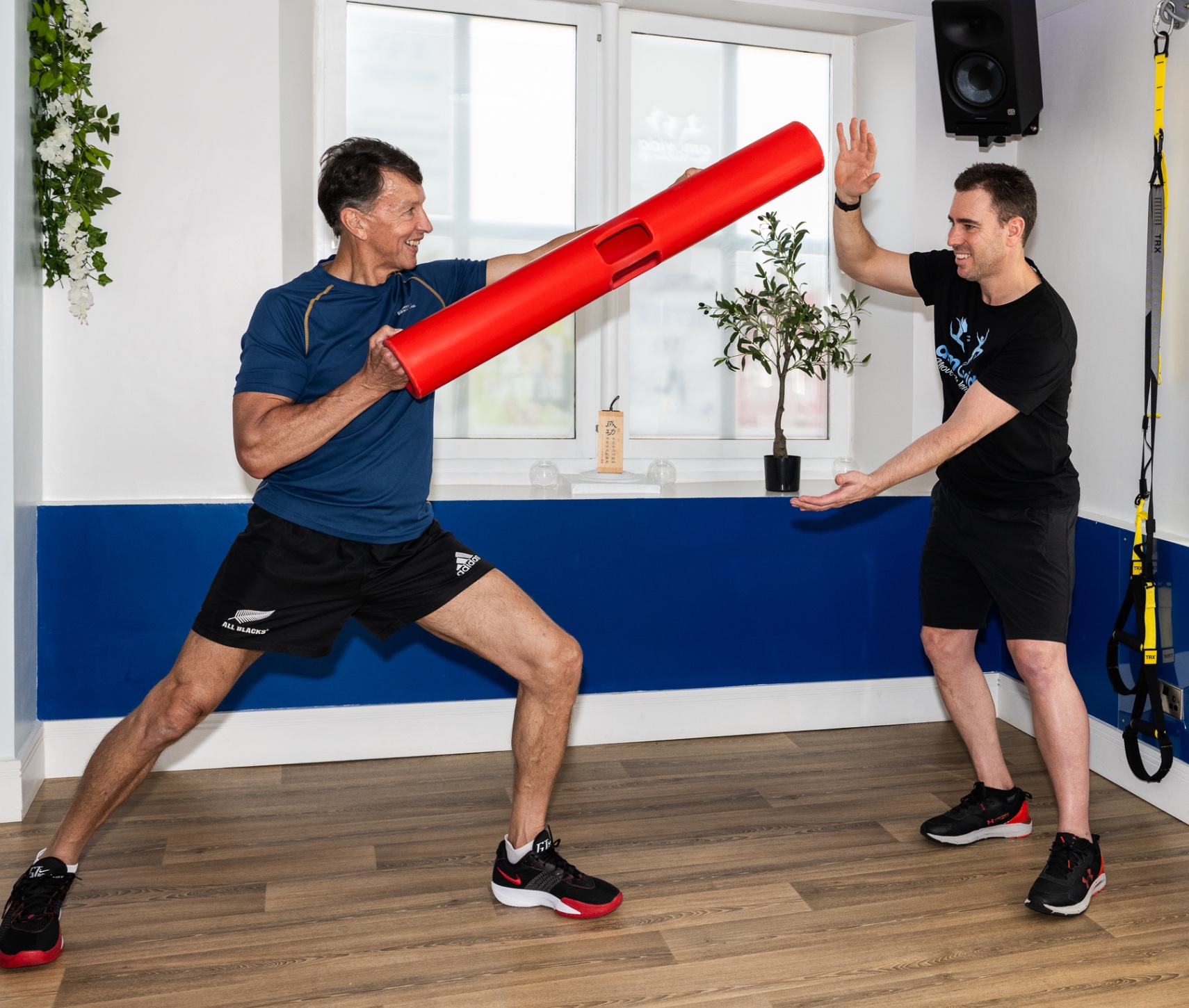 Personal Trainer with Client using ViPR Tube