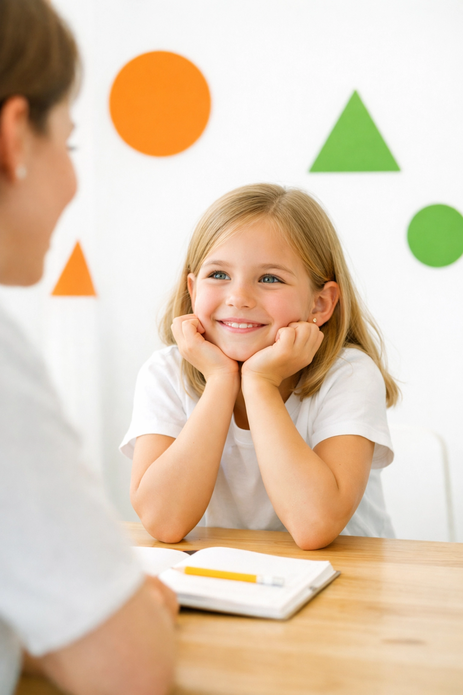 A young girl practicing respectful communication by making direct eye contact with her parent.
