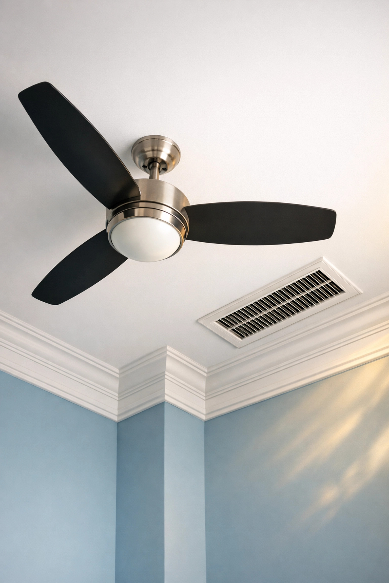 Dust-free ceiling fan and crown molding in a Marlborough home highlighting improved air quality.