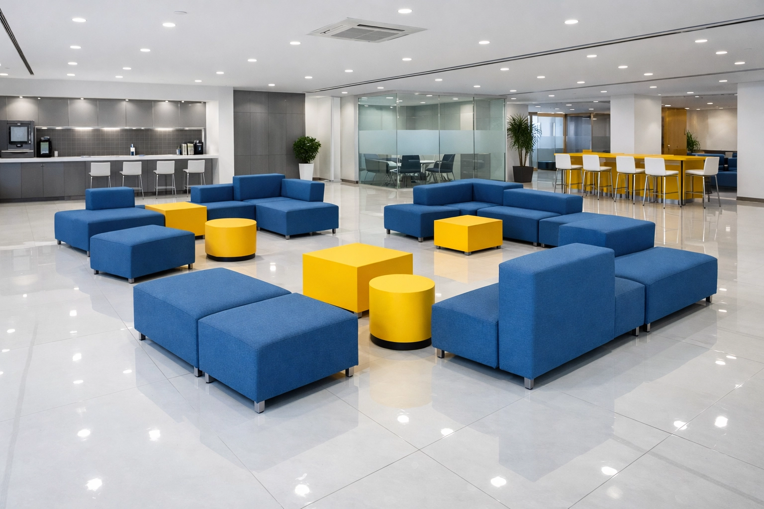 Pristine corporate breakout area in Bedford with polished floors and clean blue and yellow furniture.