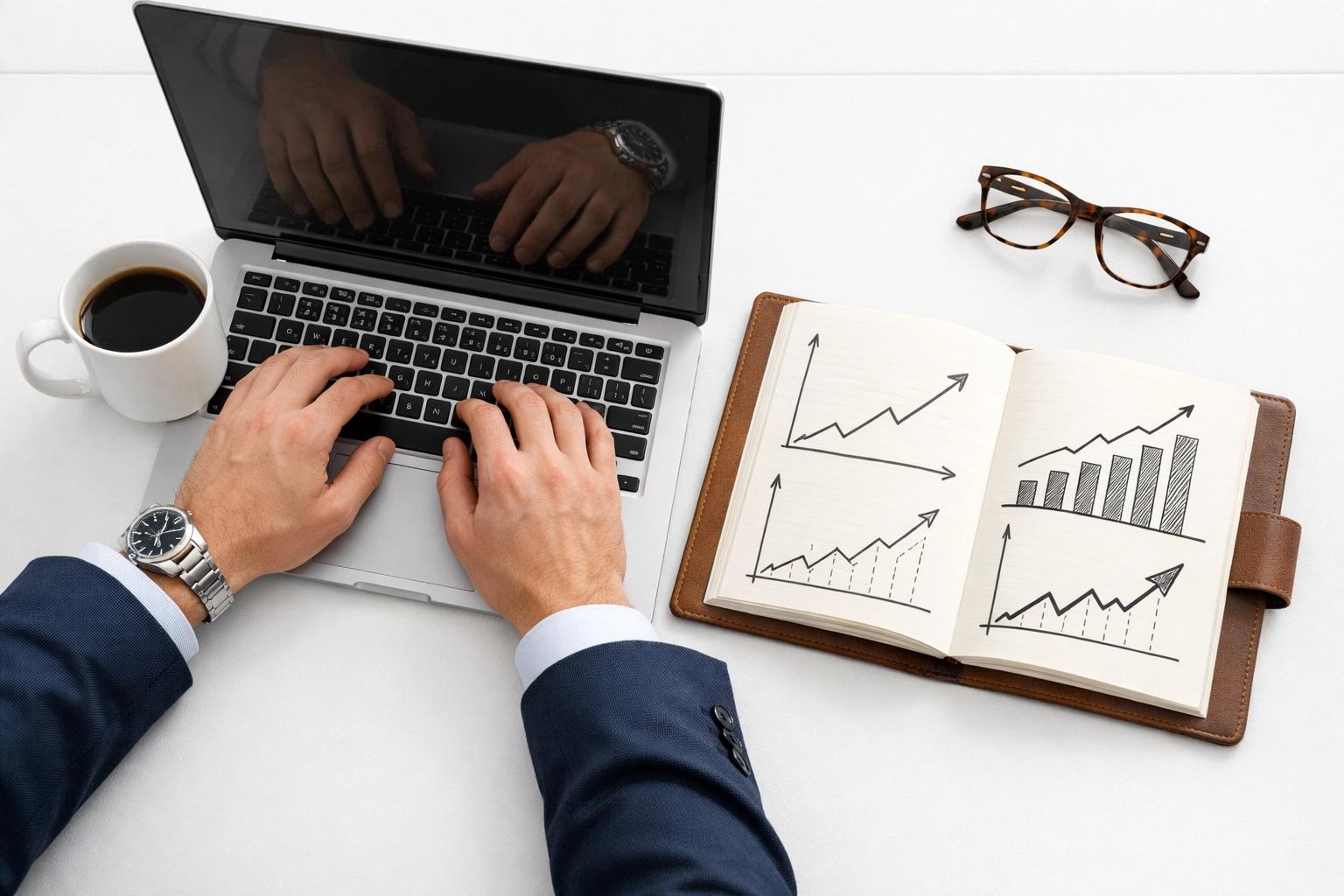 Executive desk with a laptop and growth charts representing ServiceNow ROI and optimized ITAM budgets.