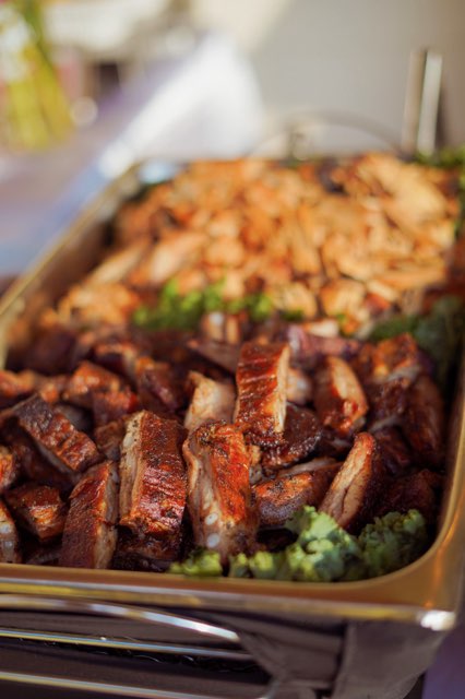 Chafing dish with smoked BBQ ribs and pulled chicken