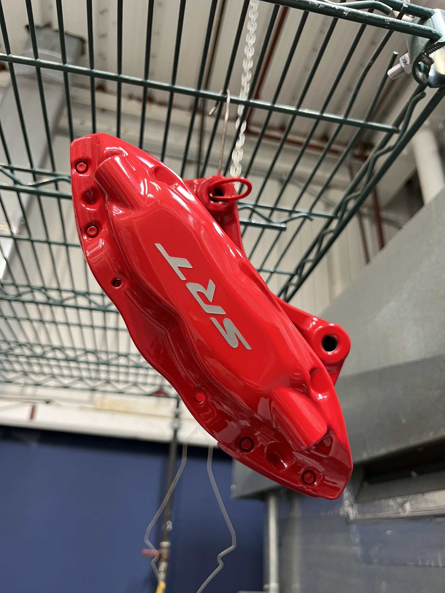 High-Gloss Red SRT powder-coated brake caliper showcasing Mopar factory color matching.
