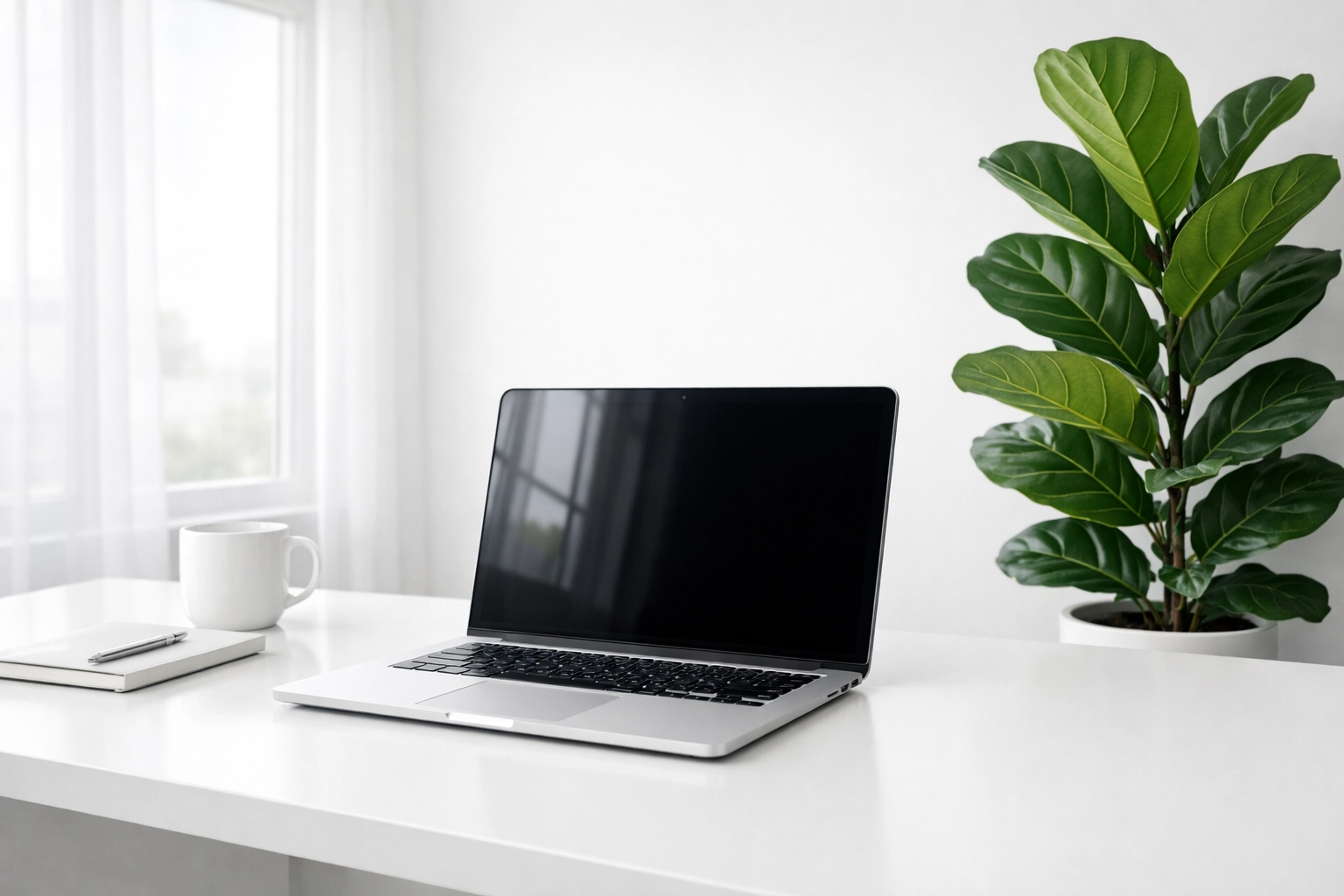 Professional minimalist office with a laptop, representing expert web development and digital services.