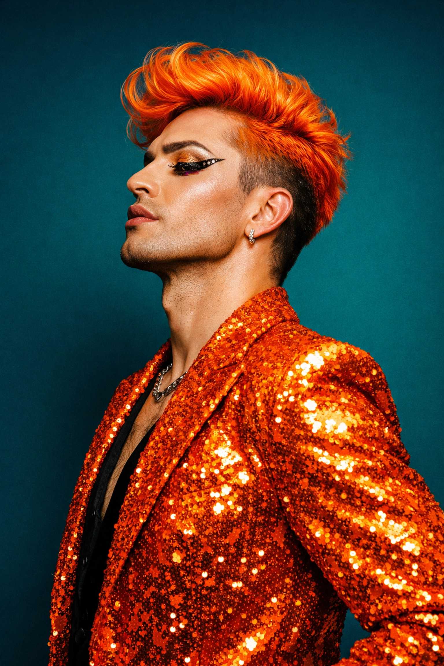 A man in a vibrant orange blazer showcasing flamboyant style, mirroring male guppy courtship colors.