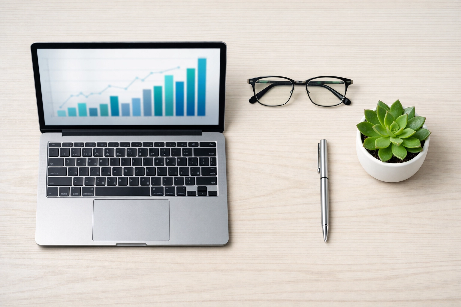 Minimalist workspace featuring financial growth charts for an Oklahoma City property management investment portfolio.