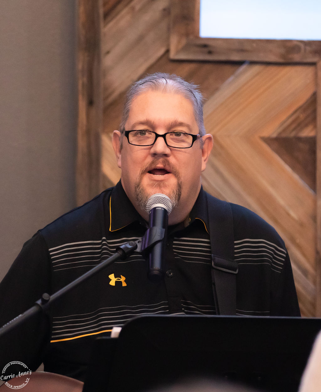 Worship team member leading music