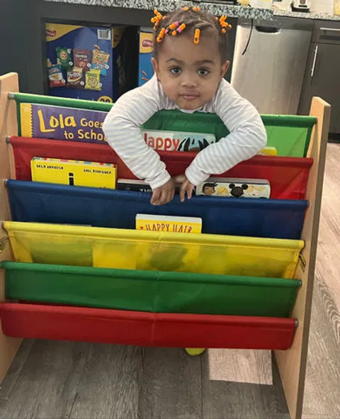 child-at-colorful-bookshelf