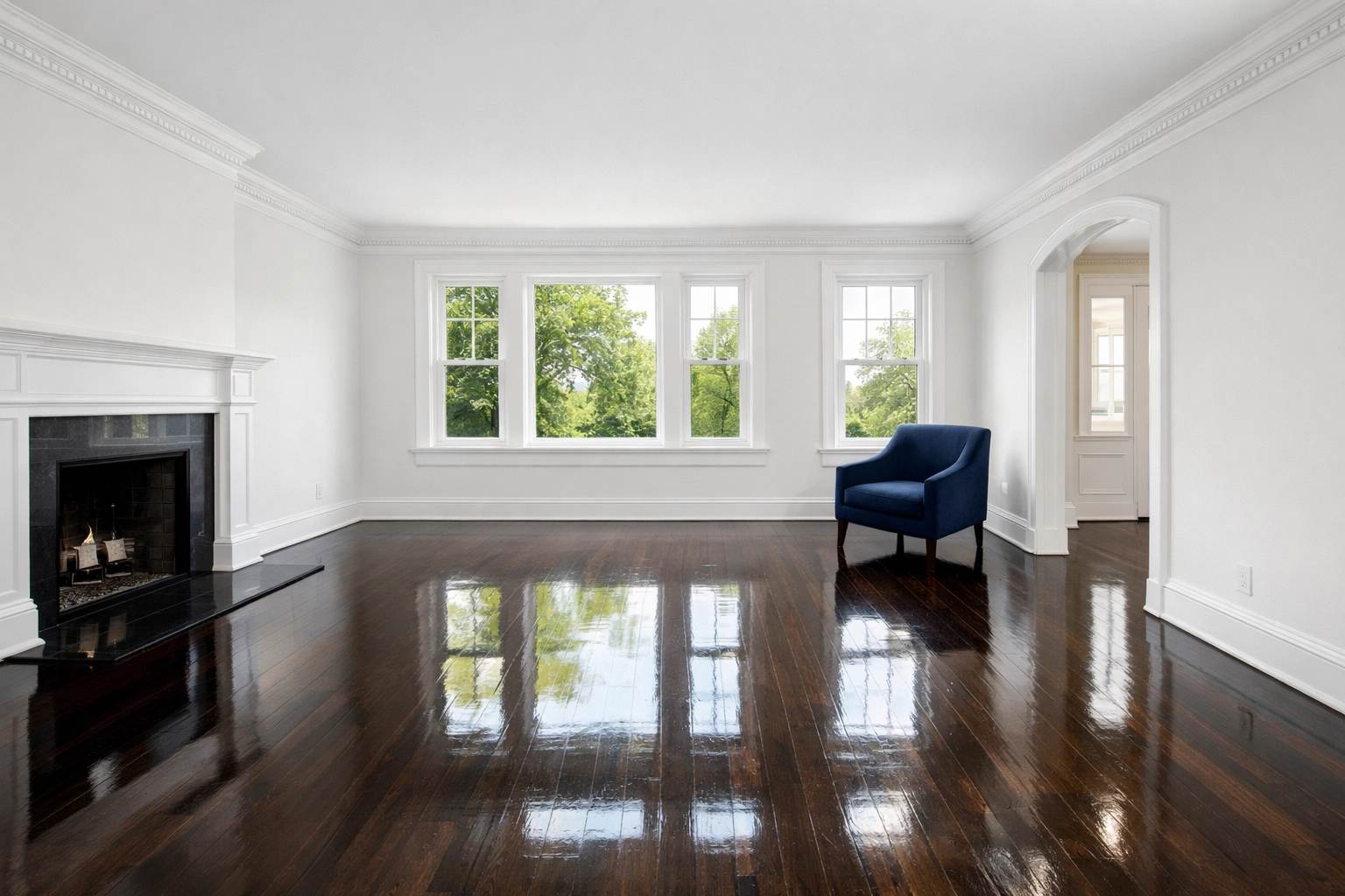 Spotless Andover living room with polished hardwood floors following professional cleaning in Andover for movers.