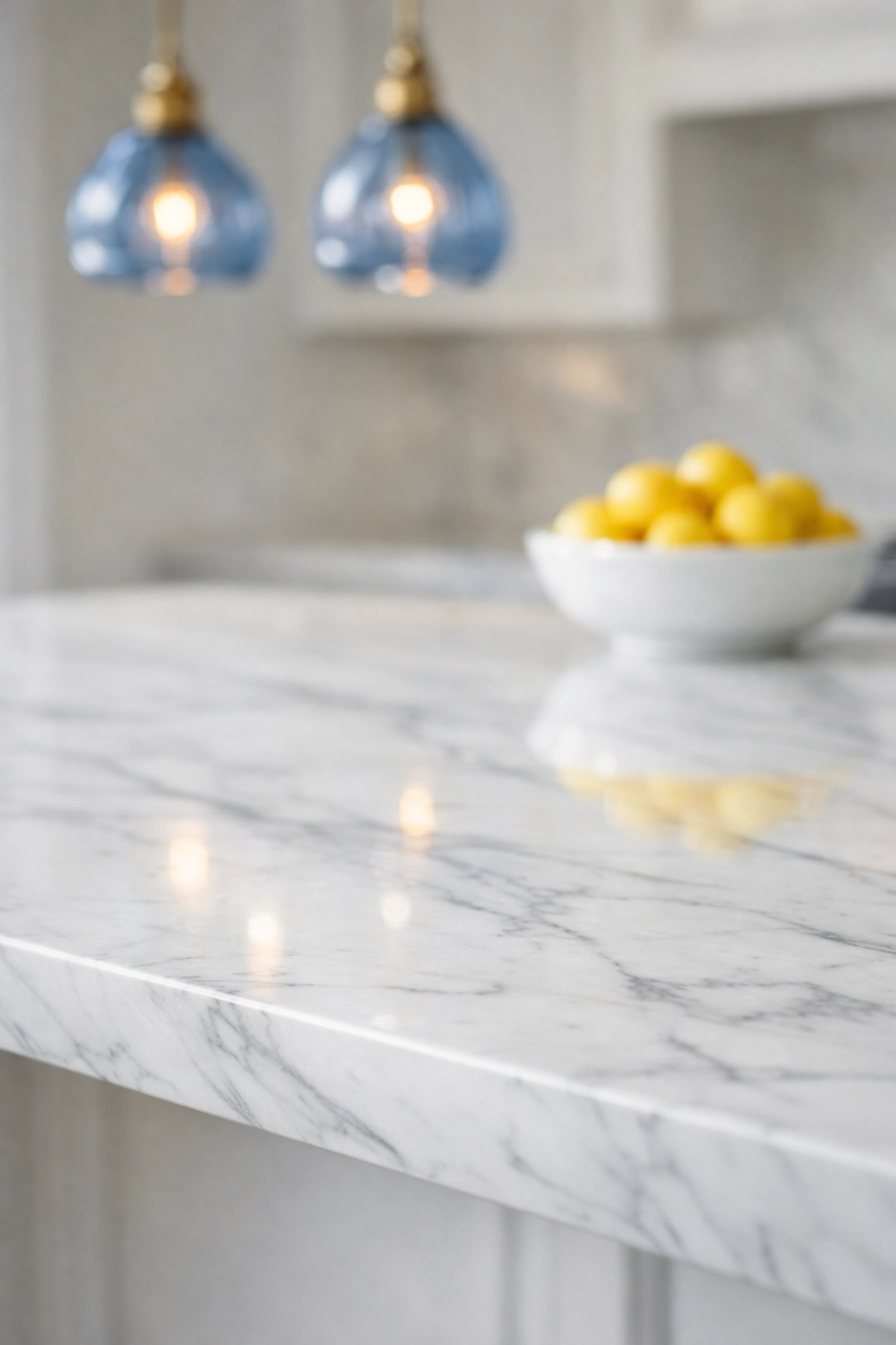 Pristine Carrara marble kitchen island in a Newton estate, demonstrating expert luxury house cleaning Newton MA.