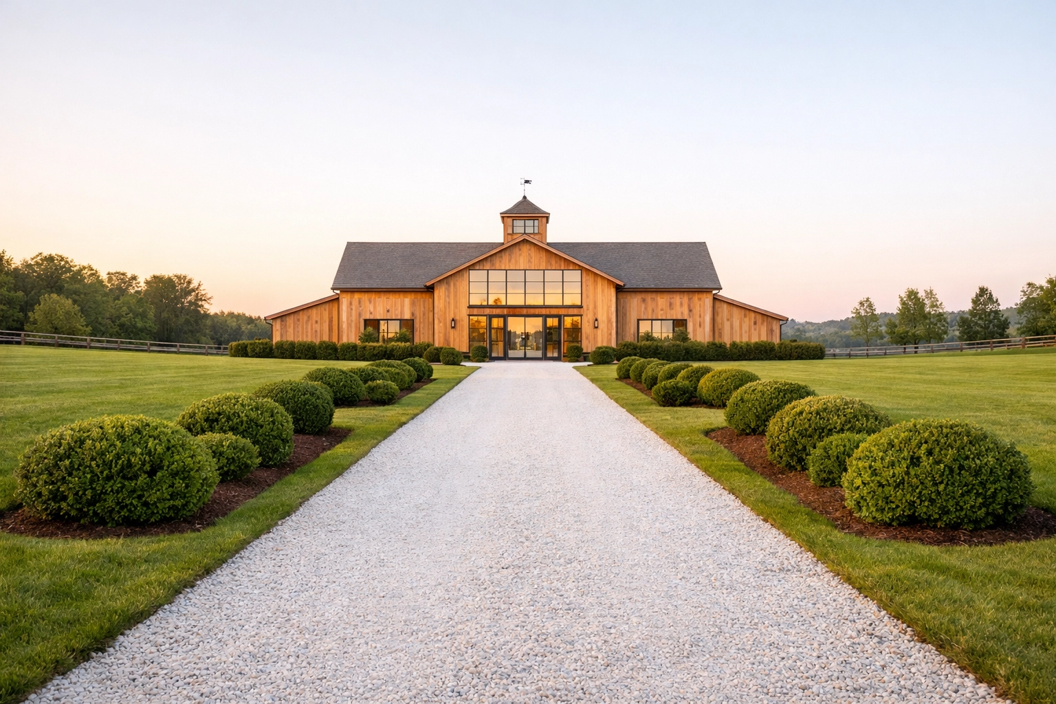 Modern cedar barn and gravel driveway at a luxury equestrian estate in Litchfield County, Connecticut.