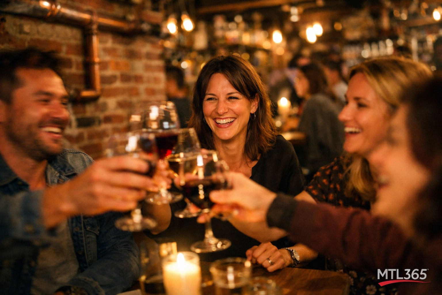 Friends toasting with wine in the vibrant, industrial-chic dining room at Gueuleton Montreal.