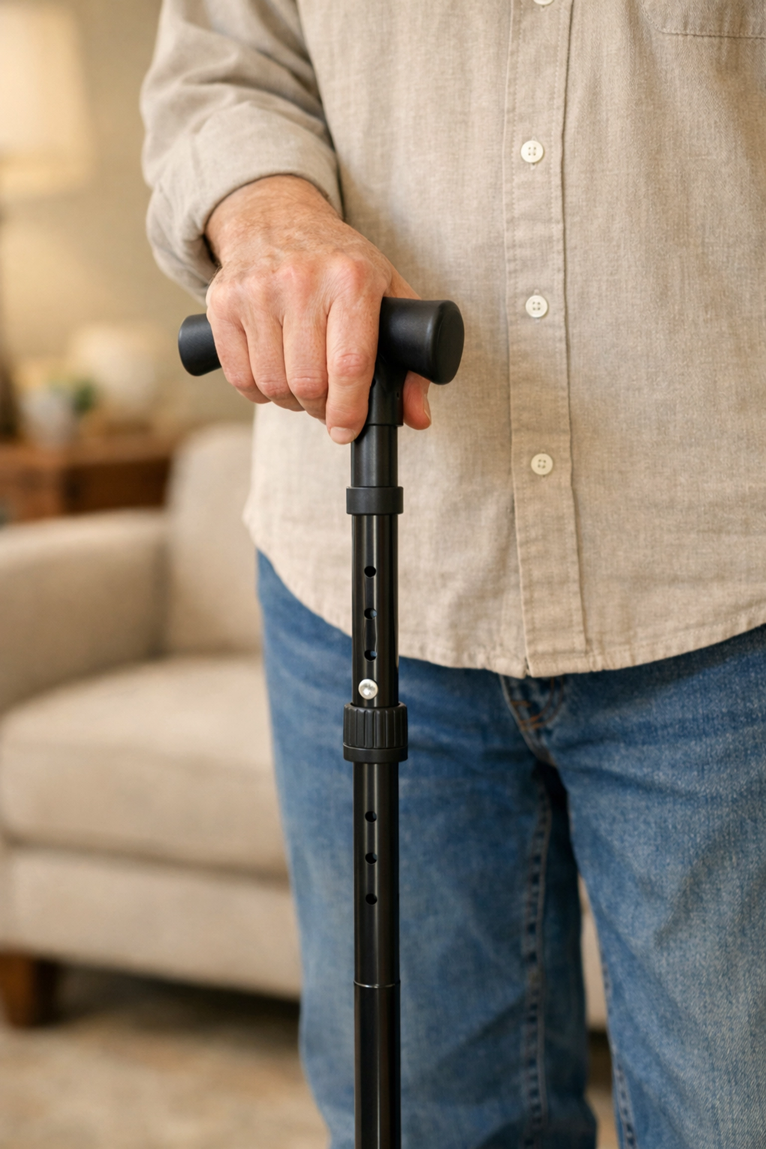 Correct cane height adjustment showing the handle at the senior's wrist crease for proper fit.