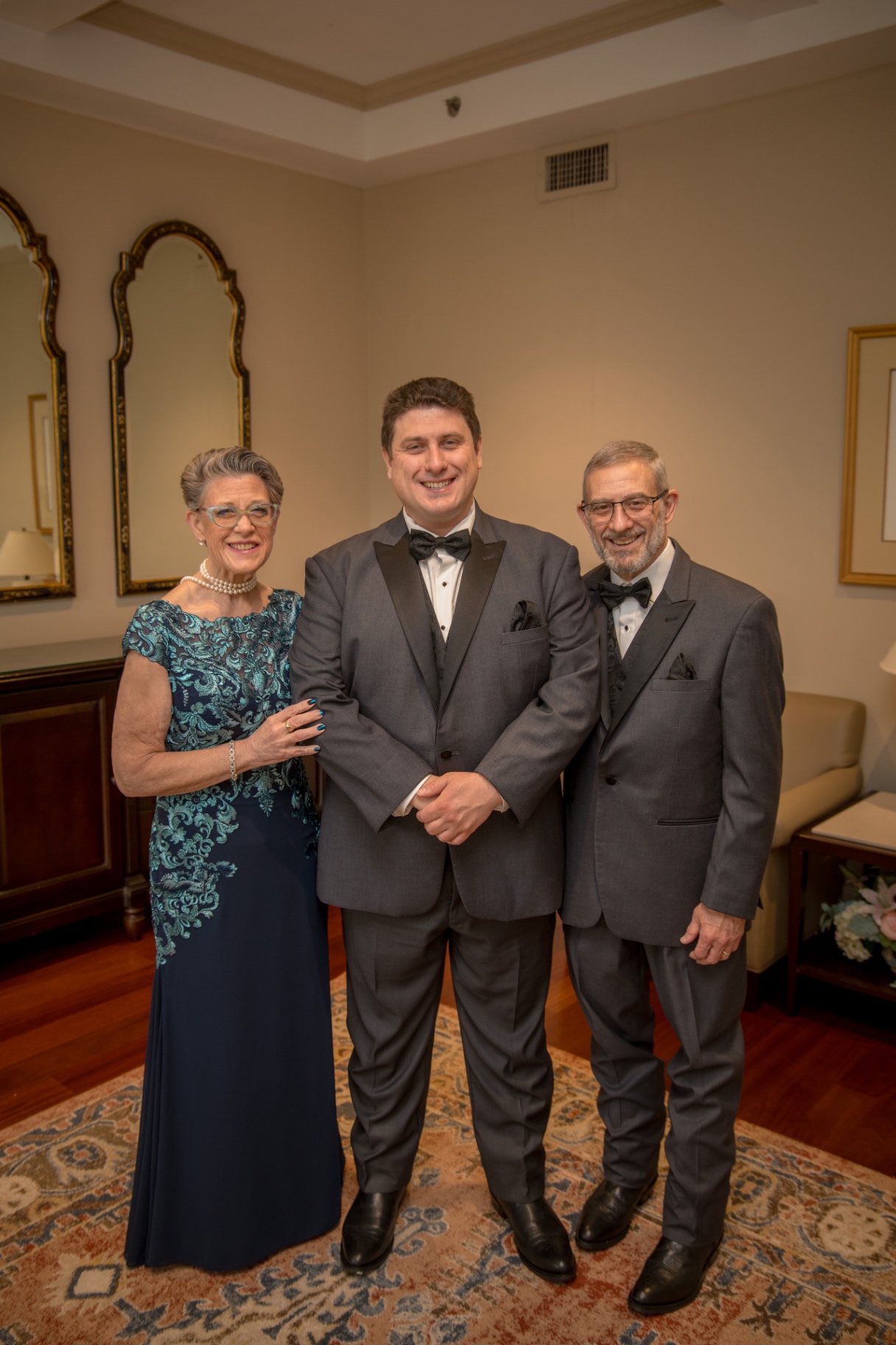 Bride and groom under romantic string lights at night