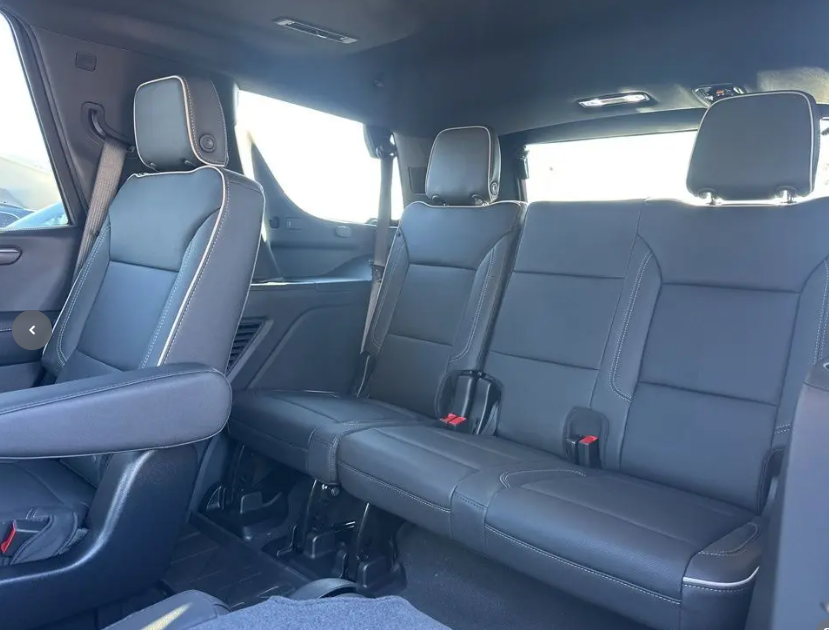 Spacious black leather interior of a luxury SUV, ideal for executive group travel
