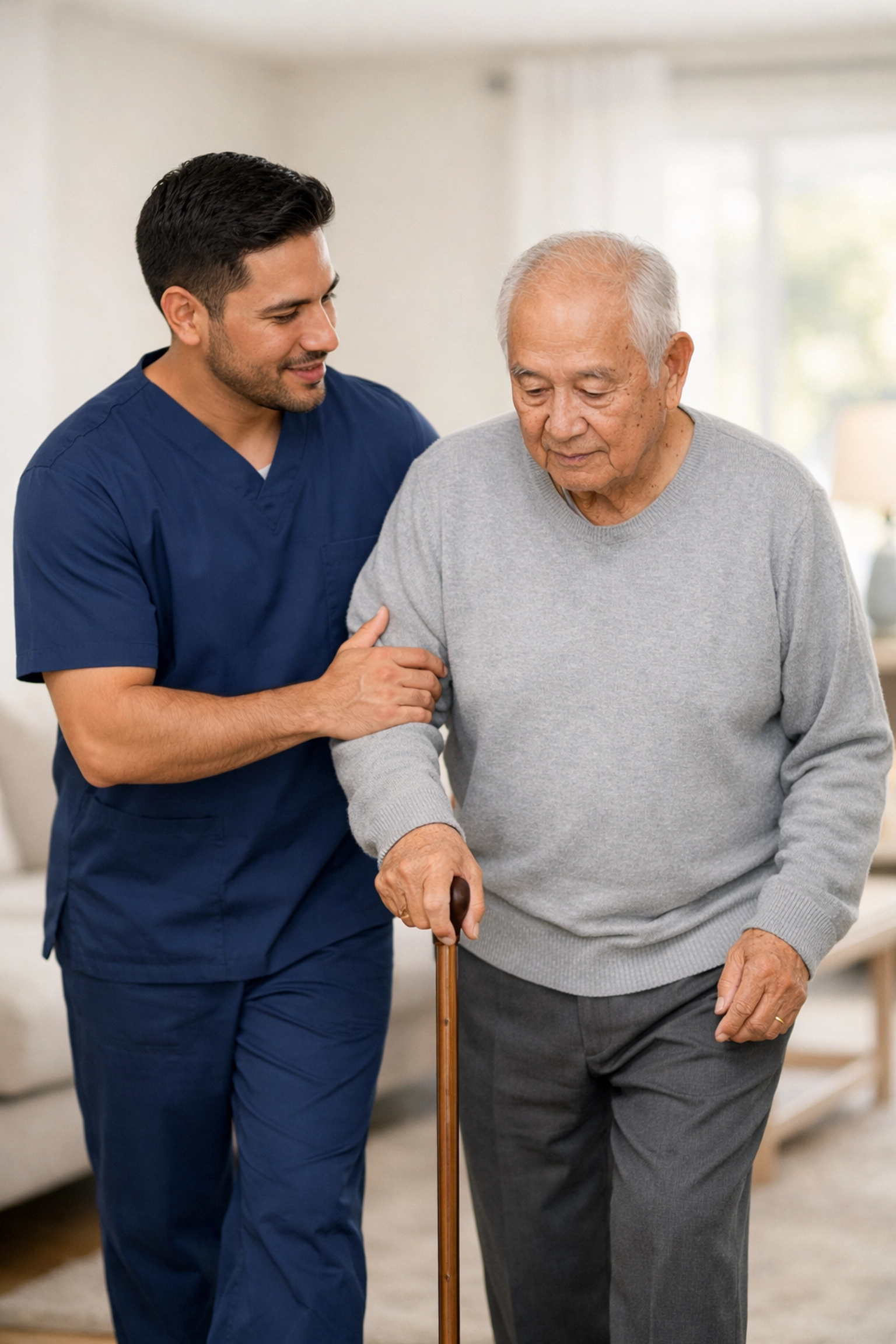 Professional caregiver assisting a senior man with mobility, ensuring safe and reliable home care.