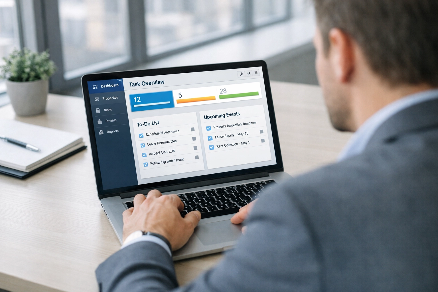 Property manager using make-ready software dashboard to track apartment turnover tasks