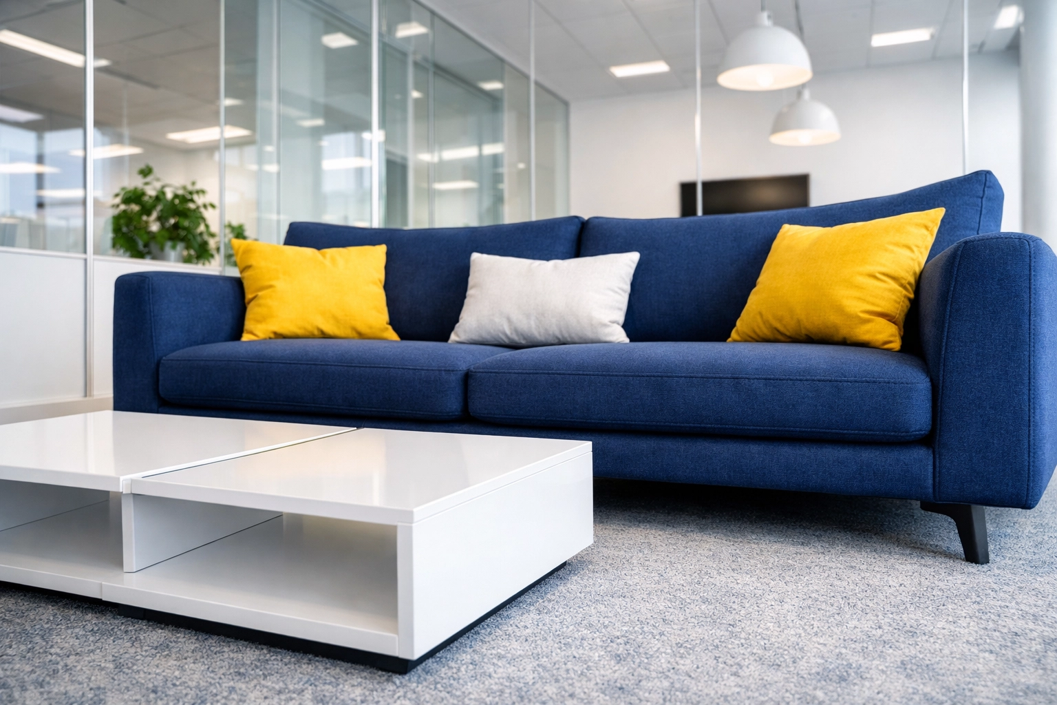 Modern Cambridge office lounge with streak-free glass partitions after a professional deep office cleaning.