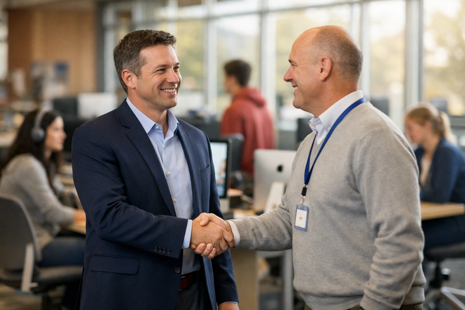 Consultant and high school official partnering on an educational technology sponsorship program.