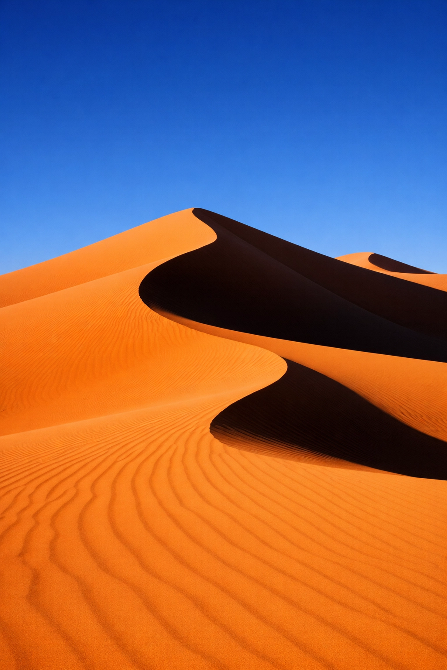 Pristine sand dunes with no distracting elements, a key fix for better landscape photography results.