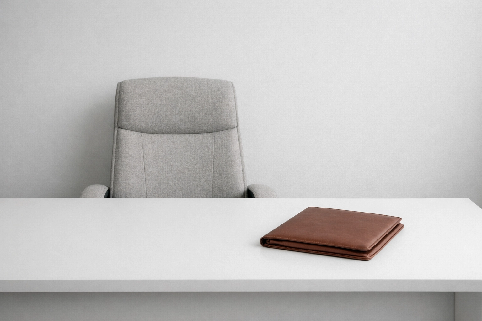 A clean, modern office desk highlighting low overhead for law firm scaling.
