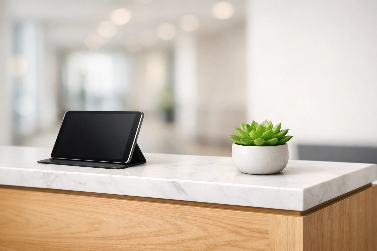 Modern office reception desk with marble tops representing professional janitorial reliability.