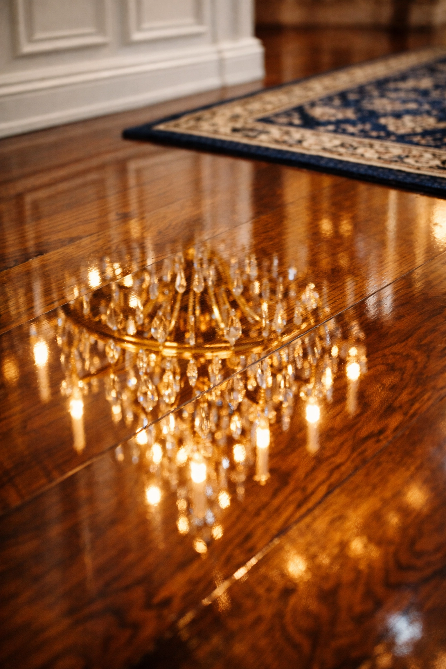 Polished hardwood floors in a luxury foyer following a professional deep cleaning service.