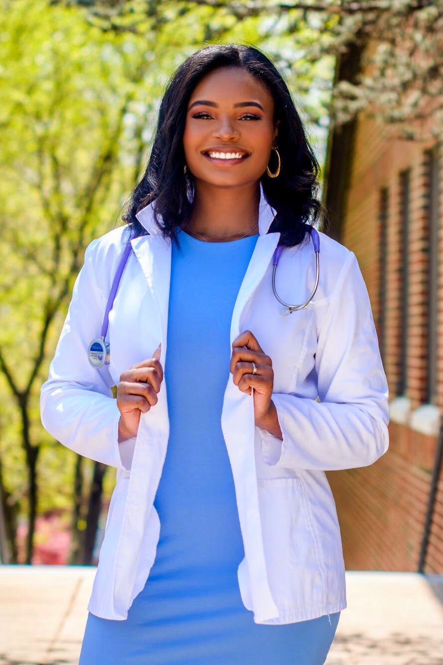 Nurse in Bright Blue Dress and White Coat