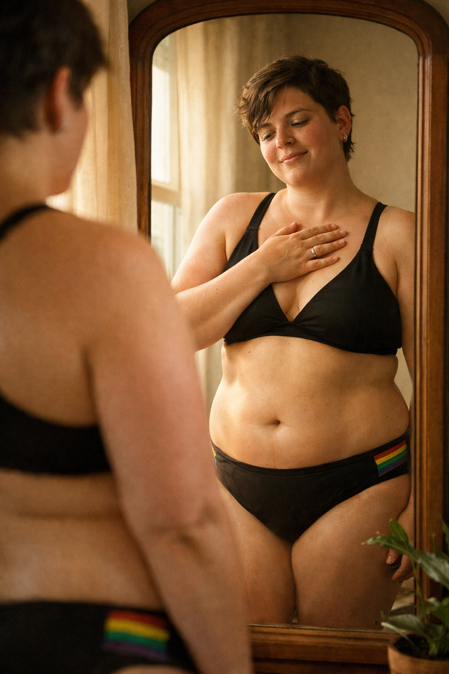 LGBTQ+ person practicing self-love and body positivity in swimwear mirror reflection