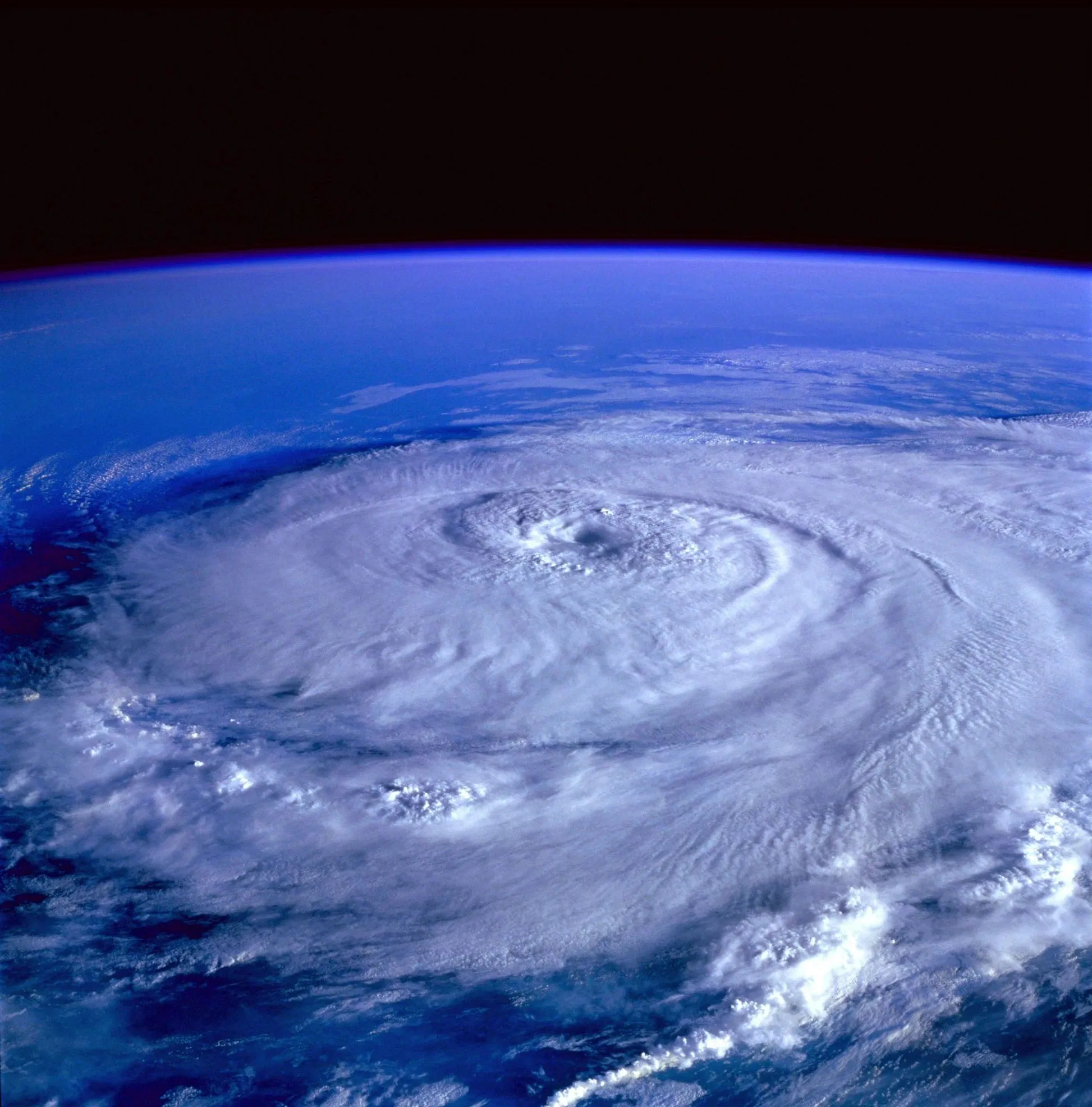 A satellite view of a hurricane approaching the Florida coast, emphasizing the scale of the risk.