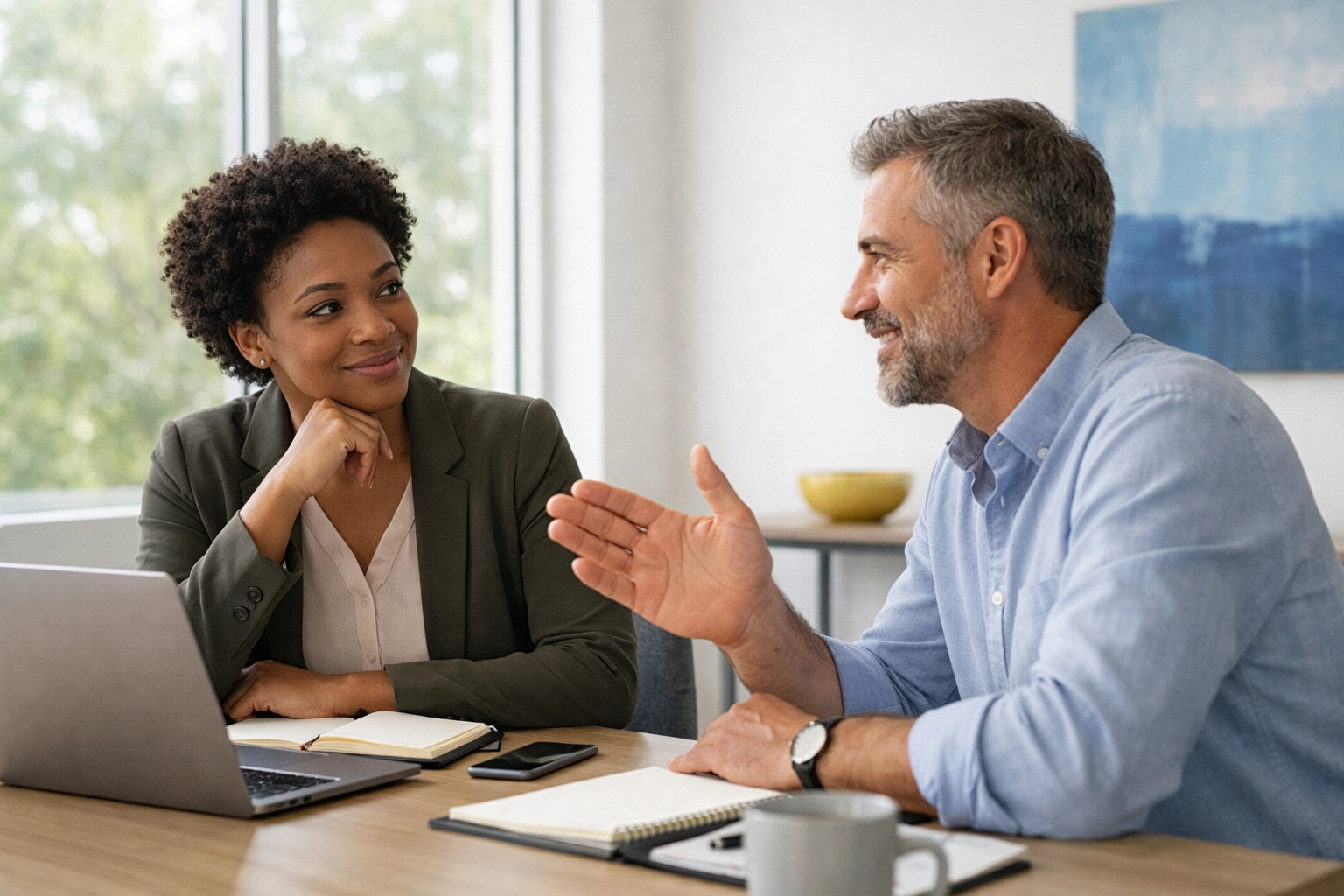 Nonprofit team members practicing donor communication and messaging in a modern meeting room.