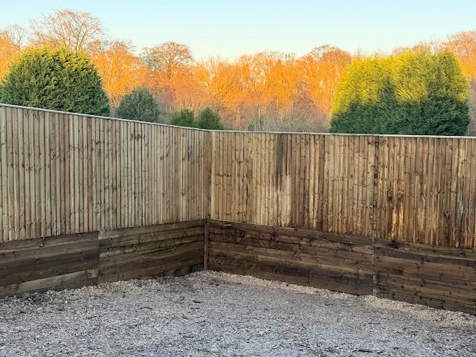Professionally installed heavy-duty timber boundary fence featuring vertical slatted panels. Built with FSC-certified pressure-treated wood for longevity.