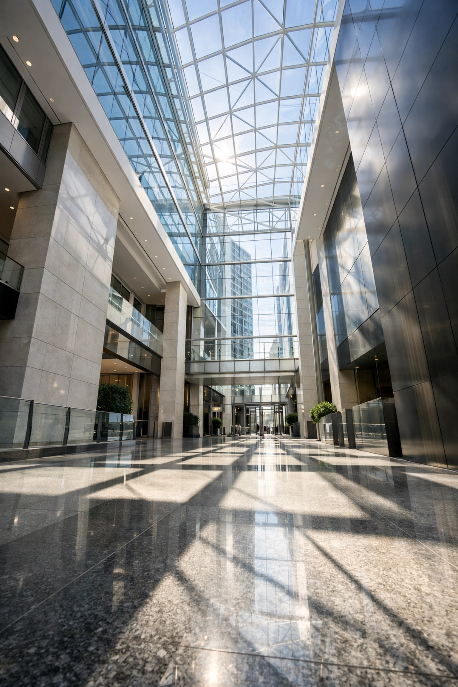 Bright corporate building lobby with polished floors and glass atrium for large-scale Midwest portfolios.