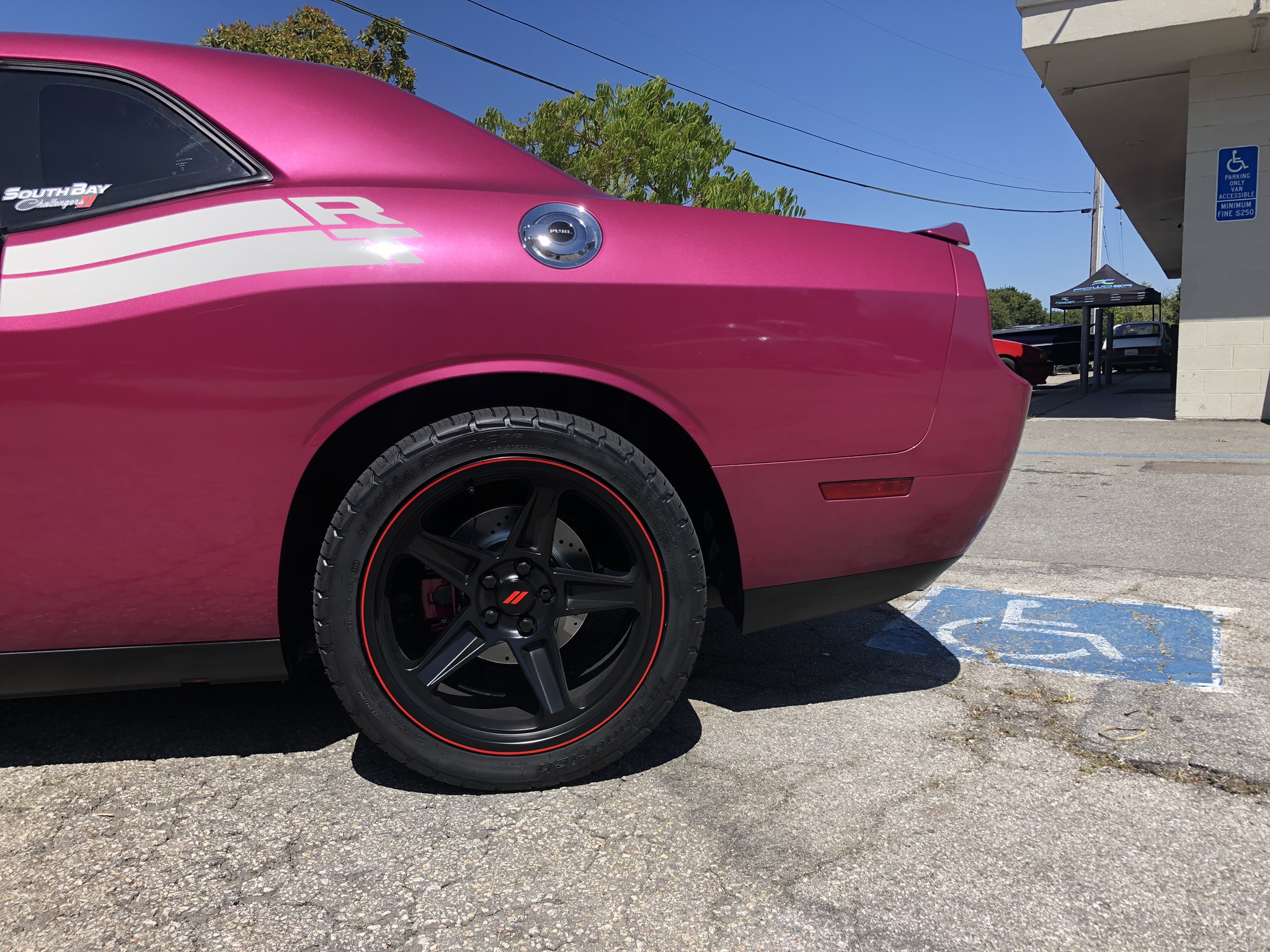 Plum Crazy Dodge Challenger Showcasing custom powder coated rear brake calipers