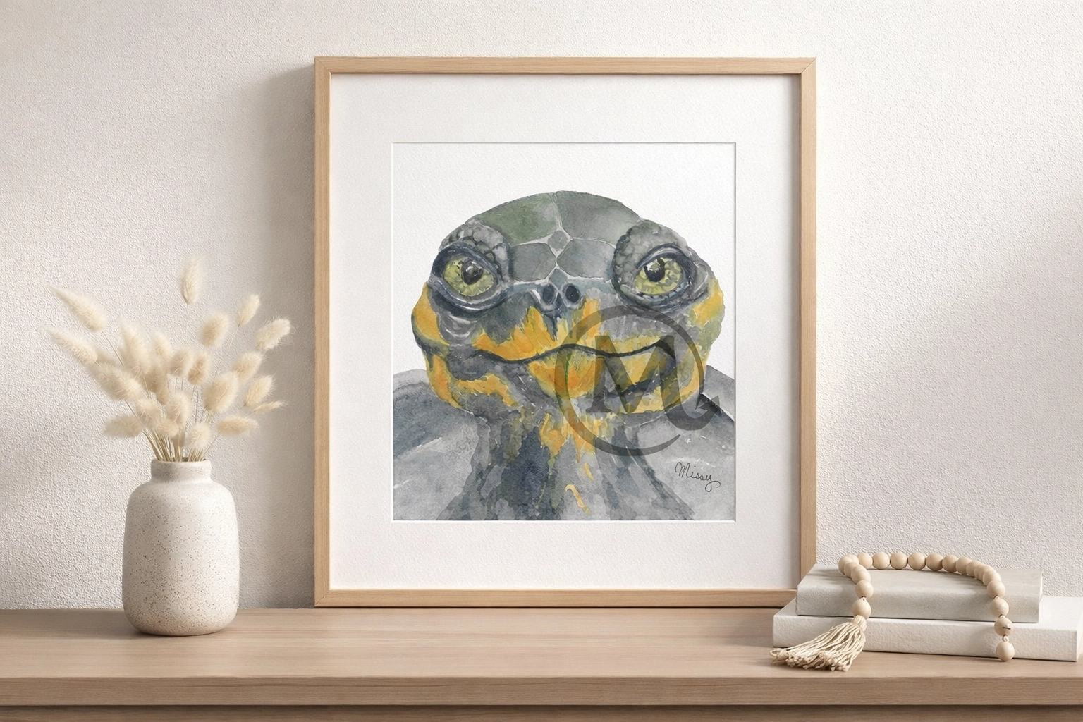 Missy’s original turtle watercolor artwork displayed inside a simple mockup frame in a neutral interior with Missy’s watermark and signature fully visible.