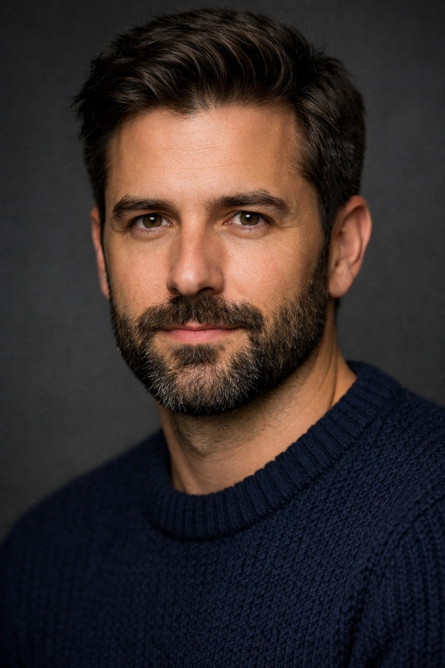 A sharp male headshot captured with a 105mm lens to demonstrate professional portrait photography techniques.