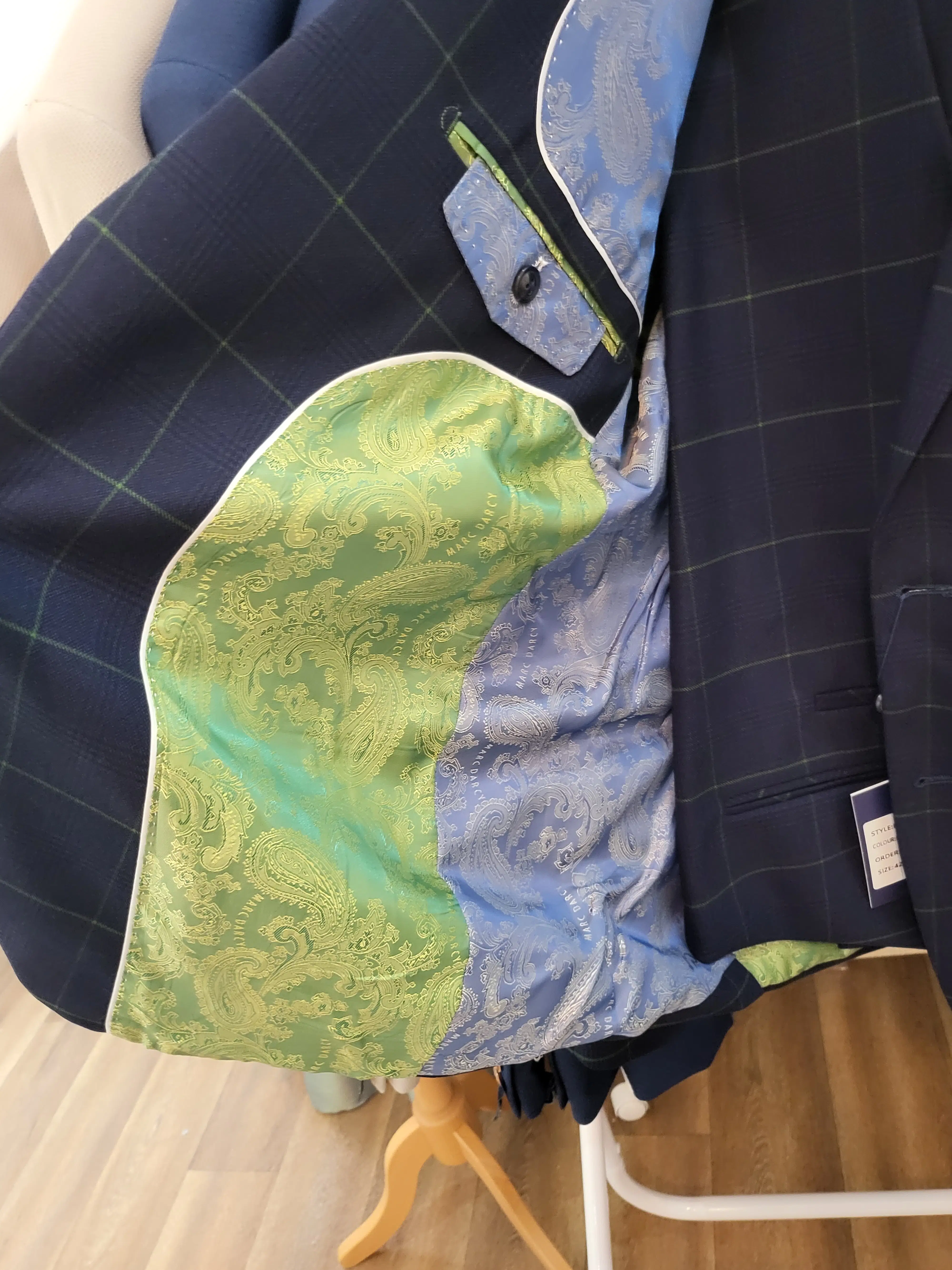 Navy Marc Darcy checked suit jacket with signature green and blue paisley lining, showcasing the bespoke luxury and attention to detail.