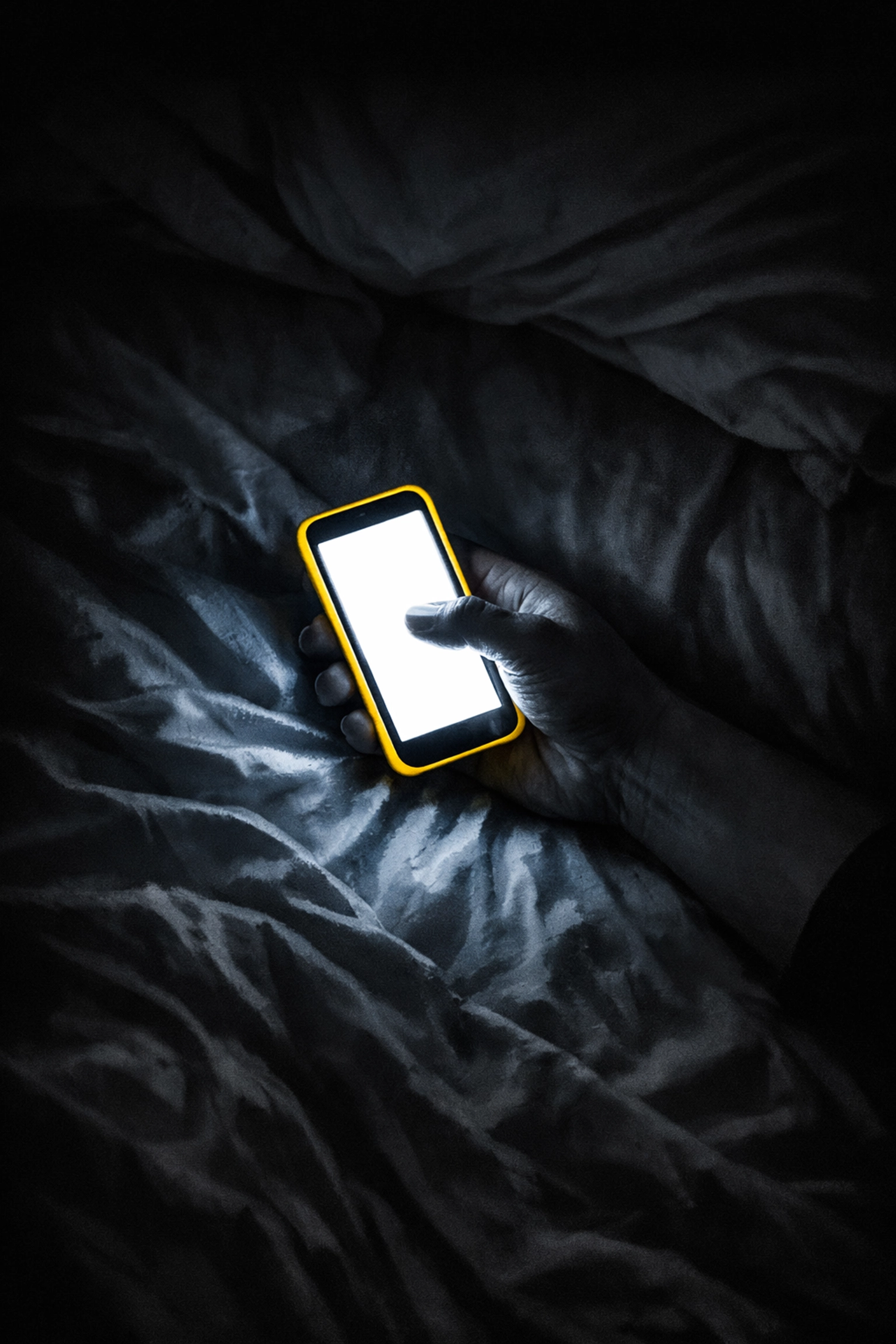 Business owner scrolling phone late at night in bed showing revenge bedtime procrastination